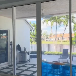 Modern residential home exterior showing premium window tinting in Miami for heat reduction and privacy.